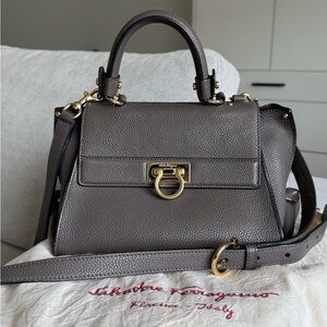 Authentic Salvatore Ferragamo Gancini Top Handle bag in grey